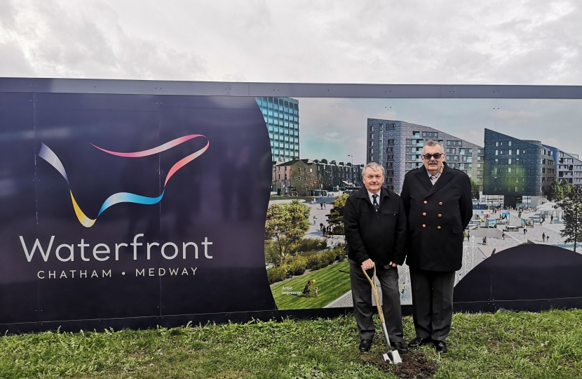 Alan Jarrett and Adrian Gulvin in front of the hoardings