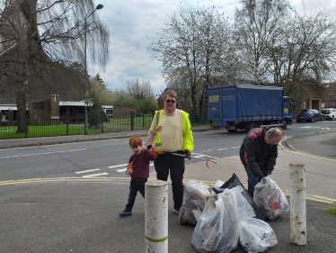 Councillor Joy and his son at the Twydall Spring Clean Event